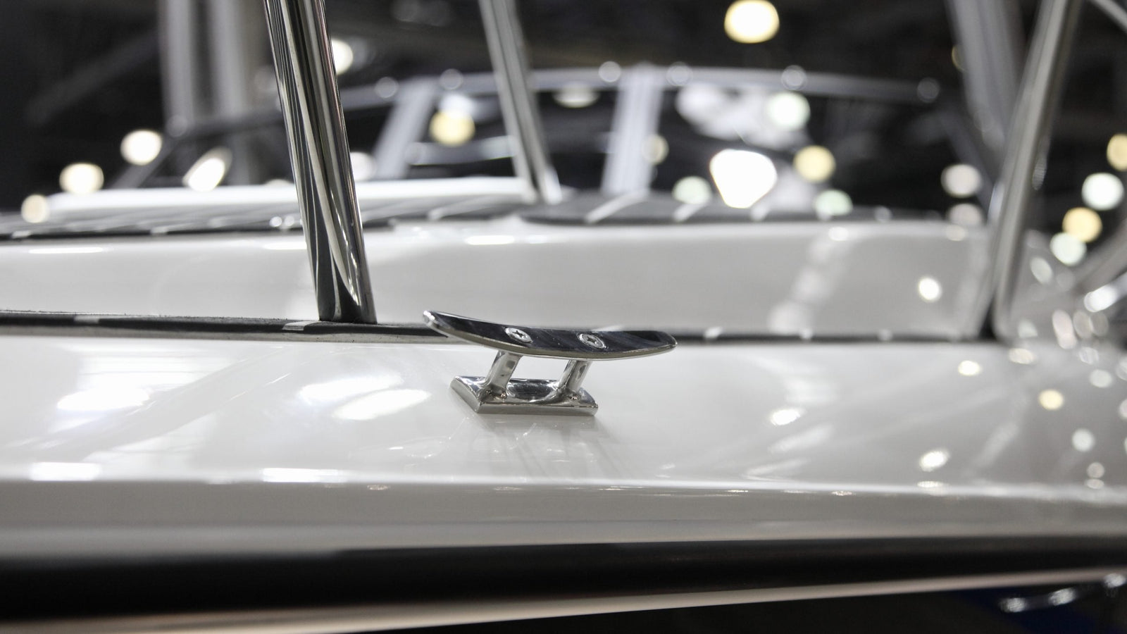 Fiberglass boat with a shiny finish after applying boat wax and polish in a marina setting outdoors