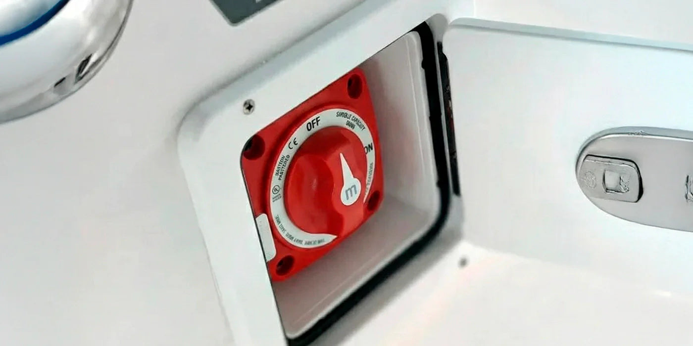 Boat battery switch installation with various marine electrical components and wiring systems nearby for safe operation