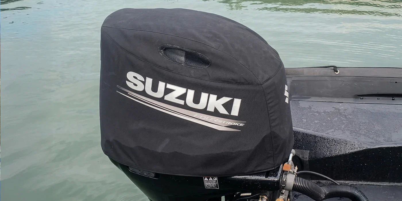 A close-up view of a covered Suzuki outboard boat motor.